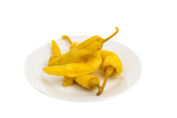 hot spicy hot pepper on a white plate isolated
