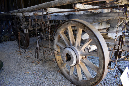 A ancient farm cart showing wheels and framework 