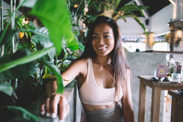 Young woman expecting friend in cafe