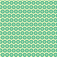 Green floral pattern on a yellow background