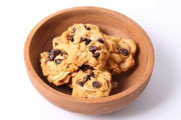 Chocolate homemade pastry biscuits in wooden bowl on white background