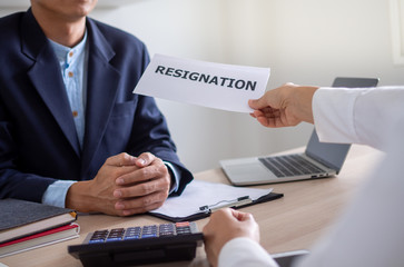Businessmen send a letter of resignation to the boss