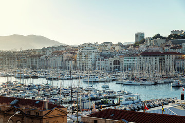 Nice view of the old port in Marseille. Snow-white sailing yachts and old beautiful architecture.
