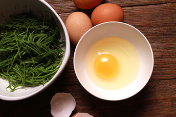 egg and acacia pennata for omelet cooking, Thai cuisine - calls that cha-om omelet