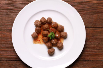 fried meat ball and sauce on white dish
