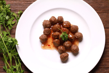 fried meat ball and sauce on white dish