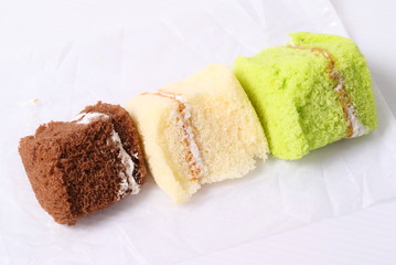 Brownie cheese cake and green tea cake on white background