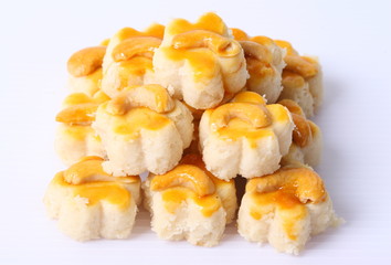 Almond macaroons on white background.