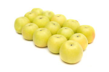 group of yellow apples on a white background, live vitamins, natural iron in fruits