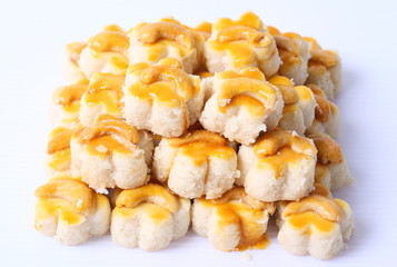 Almond macaroons on white background.