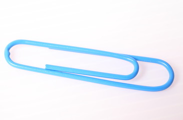 blue paper clip isolated on white