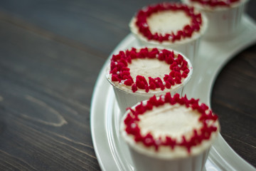 Beautiful cup cakes flowers from butter cream, in red and pink colour. Suitable for Birthday, Anniversary, Valentine Day and festive. selective focus