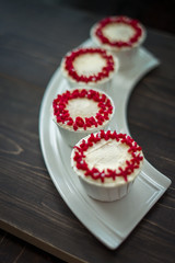 Beautiful cup cakes flowers from butter cream, in red and pink colour. Suitable for Birthday, Anniversary, Valentine Day and festive. selective focus