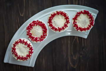 Beautiful cup cakes flowers from butter cream, in red and pink colour. Suitable for Birthday, Anniversary, Valentine Day and festive. selective focus