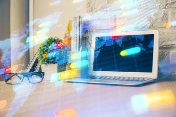 Double exposure of desktop computer and technology theme hologram. Concept of software development.