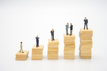 Miniature people  businessmen standing Investment Analysis Or investment. The concept of being the...