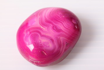 Pink gemstone on a white background