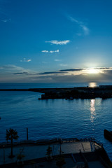 Naklejka na ściany i meble View of sunrise at Atami port