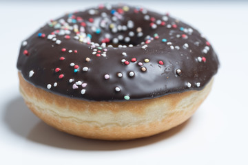 Chocolated frosted donunt with sprinkles
