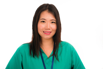 young beautiful and happy Asian Chinese medicine doctor woman or hospital nurse in green scrubs posing cheerful smiling confident in corporate clinic staff portrait