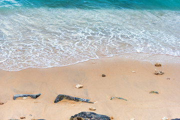 Top view Soft wave from sea come to wet sand beach background. With copy space for text or design