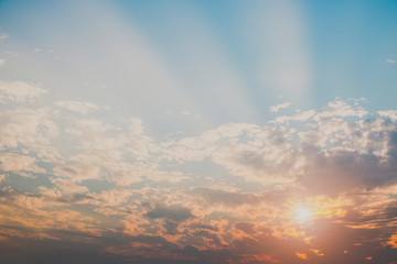 sky at sunset light penetrating with blue clouds tiny for texture background concept.