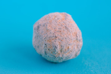 Chocolate candy sprinkled on a blue background