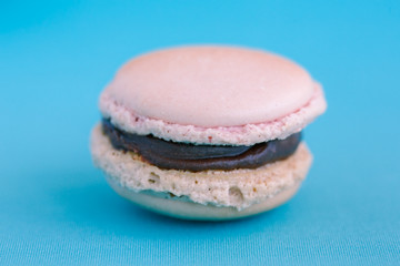 Chocolate candy sprinkled on a blue background