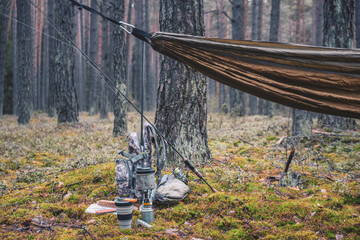 Cooking while hiking with a backpack.