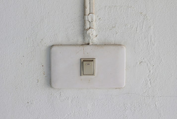 old light switch on the white wall