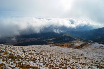 clouds and snow-capped mountains of Belmeken in Bulgaria