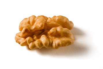 Still life with a walnut peeled on white background.