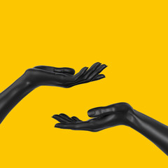 Black beautiful woman's hand sculpture isolated on yellow background. Palm up showing and...