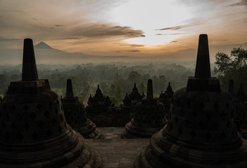 the biggest Buddhist temple in the world. Borobodur temple during sunrise with stunning colours and many stupas located close to Yogyakarta on Java, Indonesia