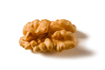 Still life with a walnut peeled on white background.