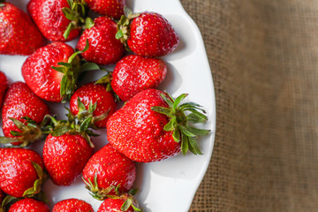 red strawberries on burlap. summer