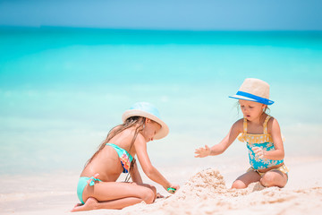 Little girls on the beach during summer vacation