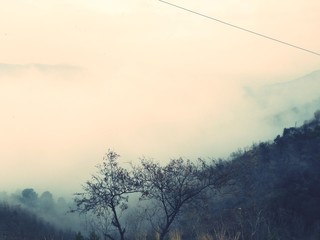 Mountains covered in heavy fog