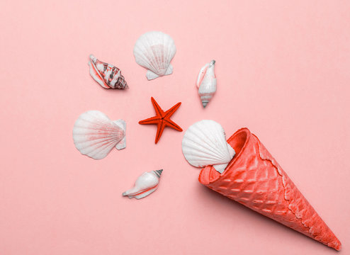 Hello Summer text on trendy Living Coral pastel color background with Shells, red starfish. Hello summer travel vacation concept, flat lay poster backdrop.