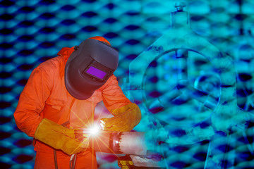 Naklejka premium Man welding process aluminum using tig handle, Industrial worker at factory welding close up.