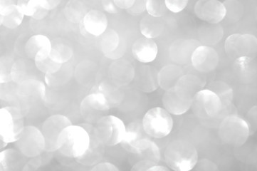 Abstract glittering silver glitter sheet reflected in sunlight