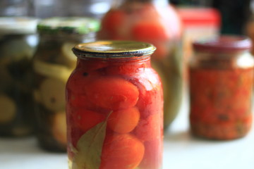 jars of pickles tomatoes and cucumbers