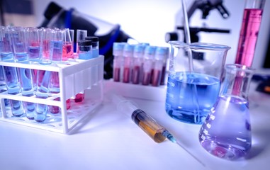 lab supplies glass test tubes, blood test tubes and microscope