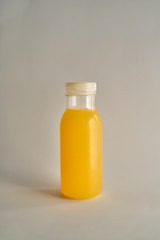 Orange bottle isolated on beige background