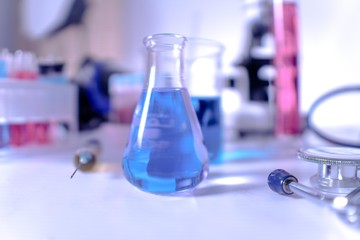 lab supplies glass test tubes, blood test tubes and microscope