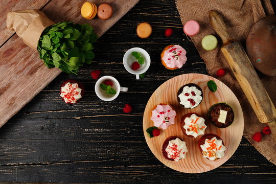 Tasty cakes on the black background