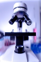 lab supplies glass test tubes, blood test tubes and microscope