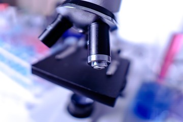 lab supplies glass test tubes, blood test tubes and microscope