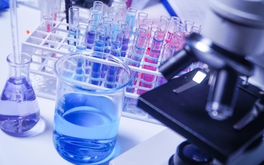 lab supplies glass test tubes, blood test tubes and microscope