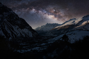 Night landscape of Himalayas with the colorful Milky Way full of stars. Manaslu trek in Nepal. - obrazy, fototapety, plakaty